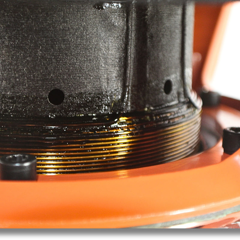 Close-up of the orange cone and Avatar-branded dust cap on the STU-1246-D2 subwoofer for SPL performance. 3