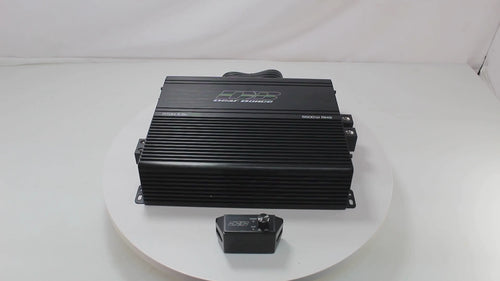 Product video showcasing the Deaf Bonce Apocalypse ATOM Pro 5500W 1-ohm Class-D monoblock amplifier, featuring a 360° view, input/output terminals, internal components, and real-world demo performance in a custom car audio system.